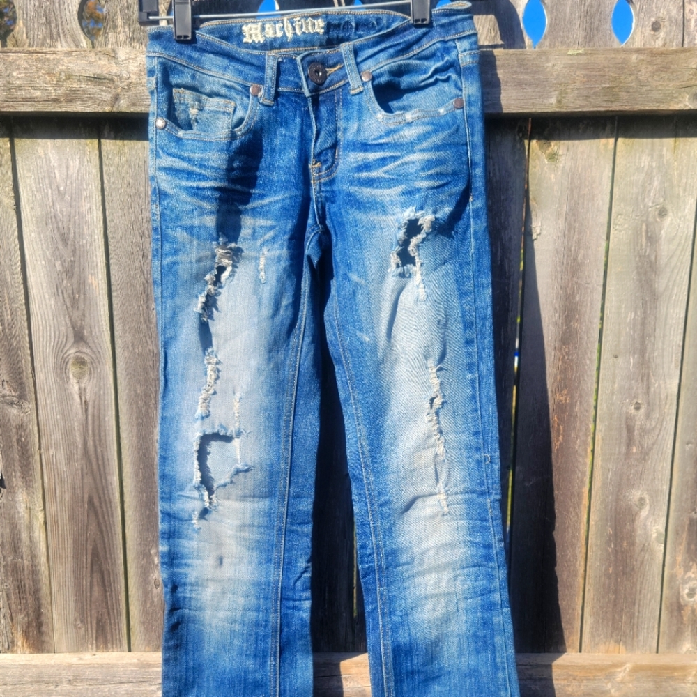 Women's machine distressed jeans